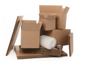 Stack of open cardboard boxes, flat packing sheets, bubble wrap, and tape on a white background.