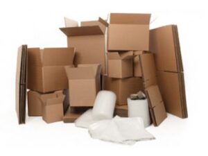 Collection of various cardboard boxes, bubble wrap, and packing materials arranged together on a white background.