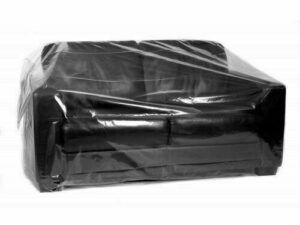 Two-seater sofa covered in a clear plastic protective wrap for moving or storage